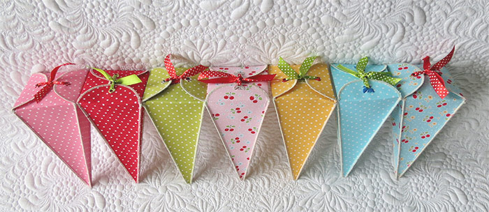 Sewing fabric treat boxes to welcome spring; sweet ideas for favors or decorations.